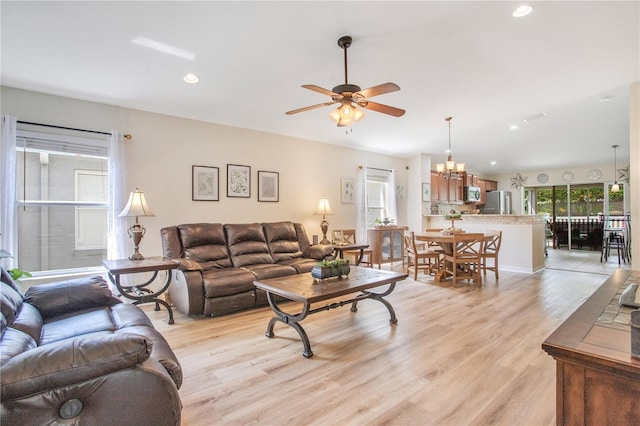 11607 Hammocks Glade Dr, Riverview, FL 33569 - living area featuring ceiling fan, light wood finished floors, recessed lighting, and a chandelier