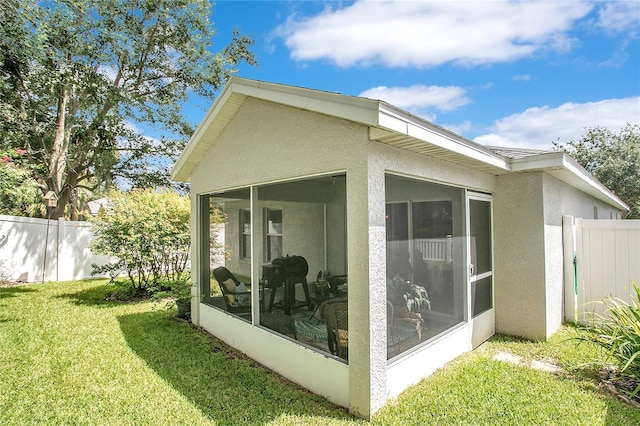 11607 Hammocks Glade Dr, Riverview, FL 33569 - view of home's exterior featuring a sunroom and stucco siding
