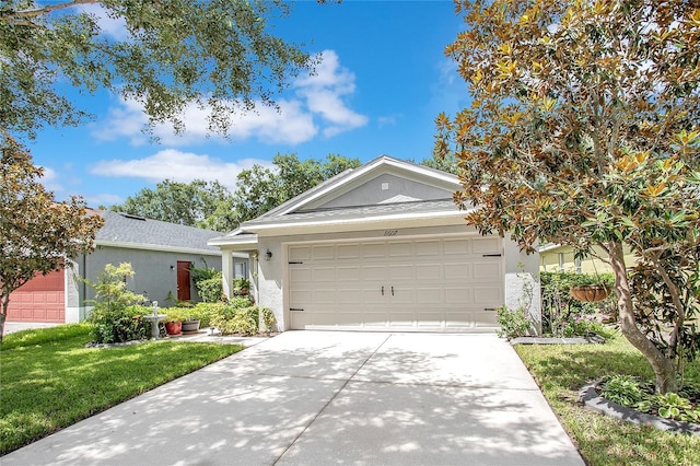 11607 Hammocks Glade Dr, Riverview, FL 33569 - ranch-style home with stucco siding, concrete driveway, a garage, and a front yard