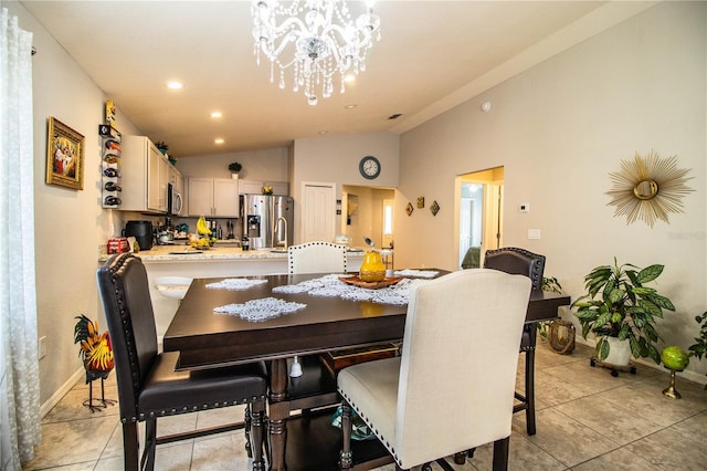 8031 Brookeshire Dr, Lakeland, FL 33809 - dining space featuring vaulted ceiling, a chandelier, light tile patterned flooring, and recessed lighting