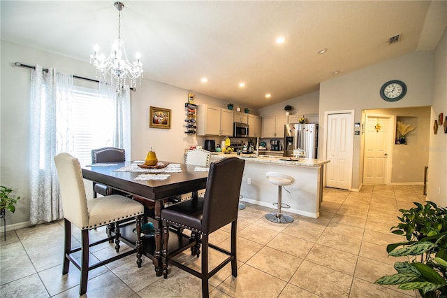 8031 Brookeshire Dr, Lakeland, FL 33809 - dining room with light tile patterned flooring, lofted ceiling, a chandelier, and recessed lighting