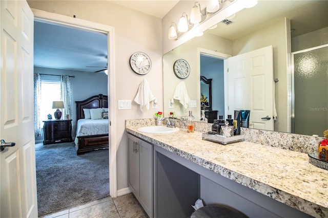 8031 Brookeshire Dr, Lakeland, FL 33809 - full bath with connected bathroom, vanity, a shower stall, and tile patterned flooring