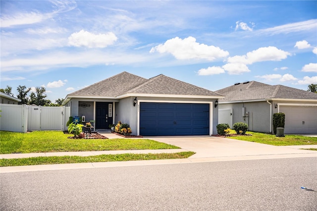 8031 Brookeshire Dr, Lakeland, FL 33809 - single story home featuring driveway, an attached garage, stucco siding, and a shingled roof