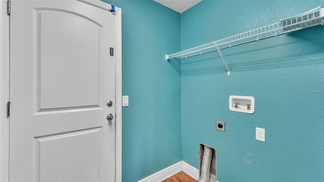 1156 Normandy Heights Cir, Winter Haven, FL 33880 - washroom with electric dryer hookup, hookup for a washing machine, wood finished floors, and a textured wall