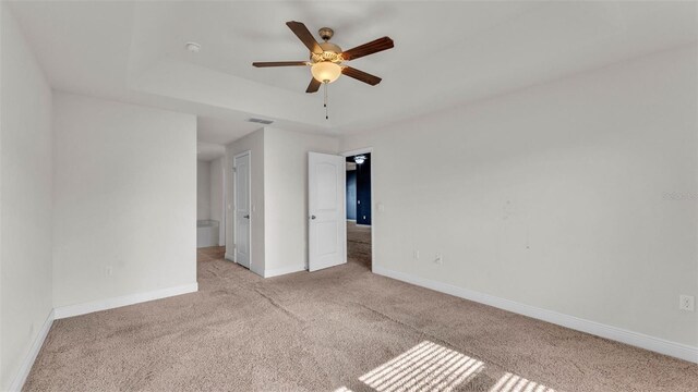 1156 Normandy Heights Cir, Winter Haven, FL 33880 - unfurnished bedroom featuring carpet floors, ensuite bathroom, and a ceiling fan
