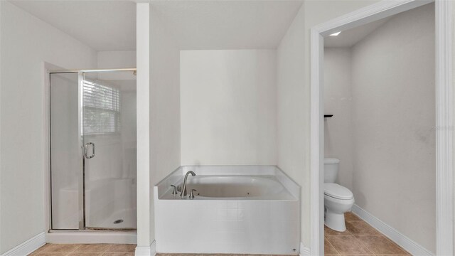 1156 Normandy Heights Cir, Winter Haven, FL 33880 - bathroom with a garden tub, a stall shower, and tile patterned floors