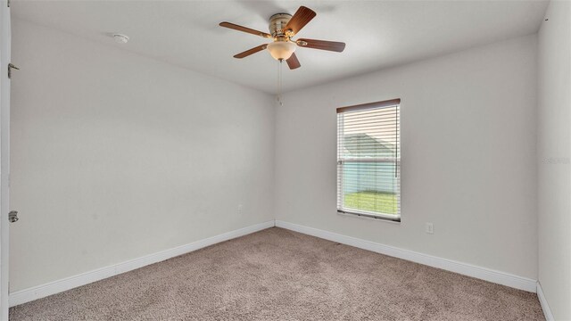 1156 Normandy Heights Cir, Winter Haven, FL 33880 - empty room with light carpet and a ceiling fan