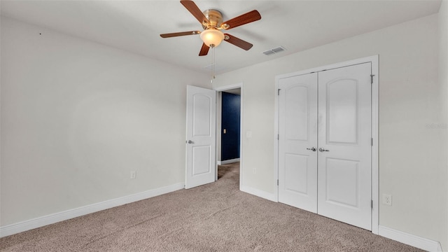 1156 Normandy Heights Cir, Winter Haven, FL 33880 - unfurnished bedroom featuring carpet, a closet, and a ceiling fan