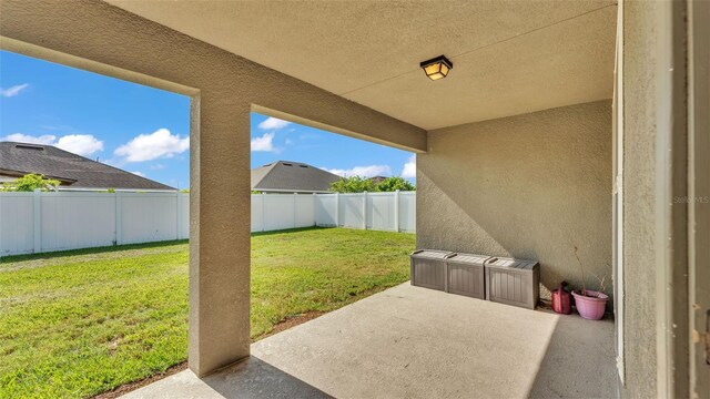 1156 Normandy Heights Cir, Winter Haven, FL 33880 - fenced backyard featuring a patio area
