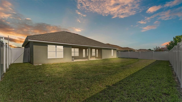 1156 Normandy Heights Cir, Winter Haven, FL 33880 - back of house with a fenced backyard and stucco siding