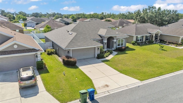 1156 Normandy Heights Cir, Winter Haven, FL 33880 - view of front of house featuring concrete driveway, an attached garage, stucco siding, a residential view, and a shingled roof