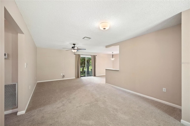 335 W Cummings St, Lake Alfred, FL 33850 - unfurnished living room with ceiling fan, a textured ceiling, and carpet flooring