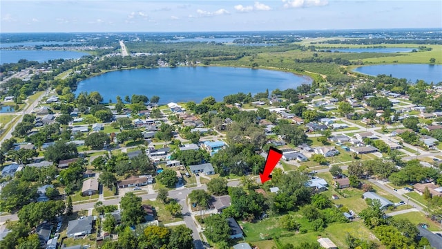 335 W Cummings St, Lake Alfred, FL 33850 - aerial view of property's location featuring a large body of water and nearby suburban area