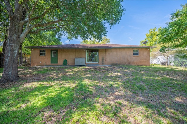 335 W Cummings St, Lake Alfred, FL 33850 - back of house featuring brick siding