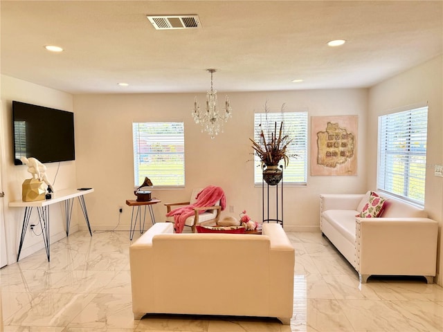 1302 W 8th St, Lakeland, FL 33805 - living area with light marble finish flooring, plenty of natural light, recessed lighting, and a chandelier