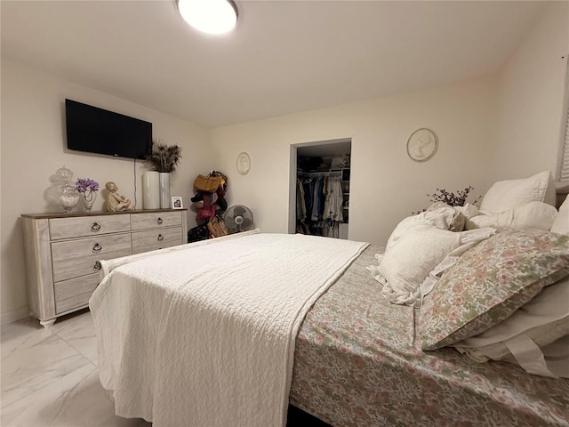 1302 W 8th St, Lakeland, FL 33805 - bedroom with light marble finish flooring and a walk in closet