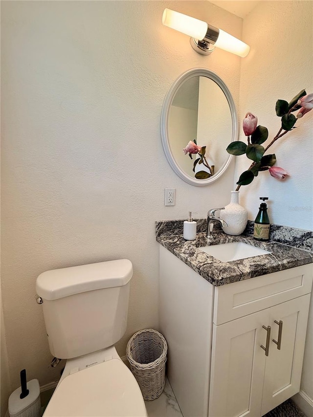 1302 W 8th St, Lakeland, FL 33805 - half bathroom featuring vanity and marble finish floors