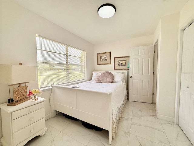 1302 W 8th St, Lakeland, FL 33805 - bedroom featuring light marble finish floors