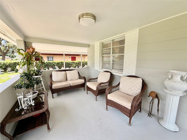 1302 W 8th St, Lakeland, FL 33805 - covered porch with an outdoor hangout area