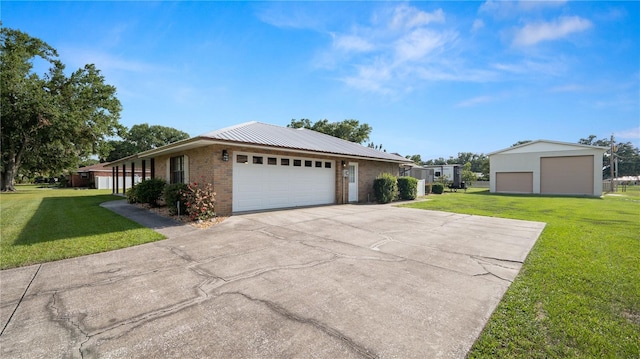 6504 Hereford Dr, Lakeland, FL 33810 - view of front of property with brick siding, a front lawn, driveway, and a garage