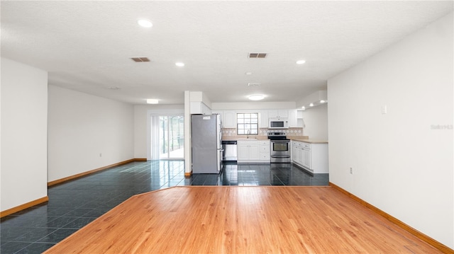 6504 Hereford Dr, Lakeland, FL 33810 - unfurnished living room featuring recessed lighting and dark wood-type flooring
