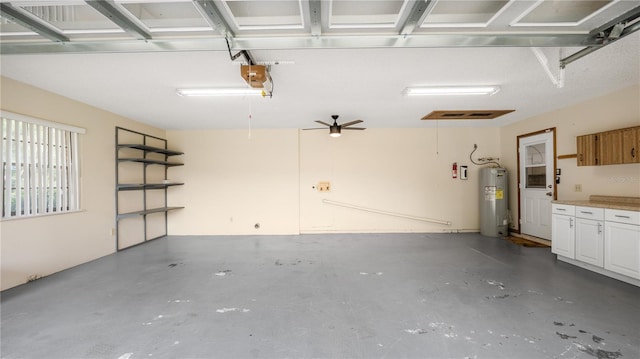 6504 Hereford Dr, Lakeland, FL 33810 - garage with electric water heater and a garage door opener