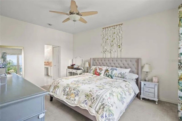 3999 Whistlewood Cir, Lakeland, FL 33811 - bedroom with light carpet, a ceiling fan, and connected bathroom