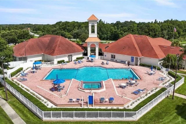 3999 Whistlewood Cir, Lakeland, FL 33811 - community pool with a wooded view