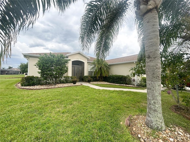 3999 Whistlewood Cir, Lakeland, FL 33811 - view of front of property featuring stucco siding and a front yard