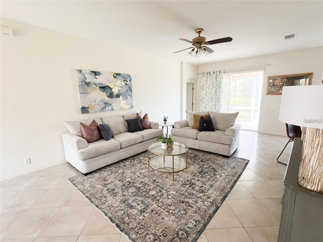 3999 Whistlewood Cir, Lakeland, FL 33811 - living room featuring light tile patterned flooring, a ceiling fan, and arched walkways