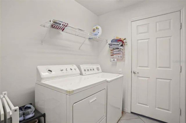 3999 Whistlewood Cir, Lakeland, FL 33811 - washroom with separate washer and dryer and light tile patterned flooring