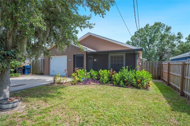735 Virginia Ave, Auburndale, FL 33823 - view of front of property featuring driveway, stucco siding, and a garage