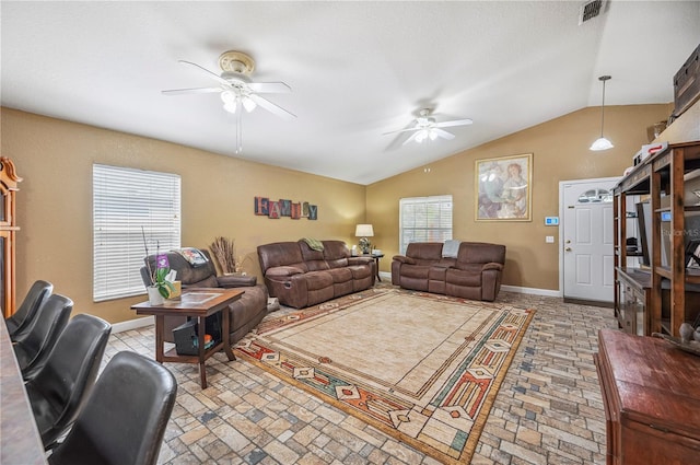 735 Virginia Ave, Auburndale, FL 33823 - living room with ceiling fan, vaulted ceiling, and brick patterned flooring