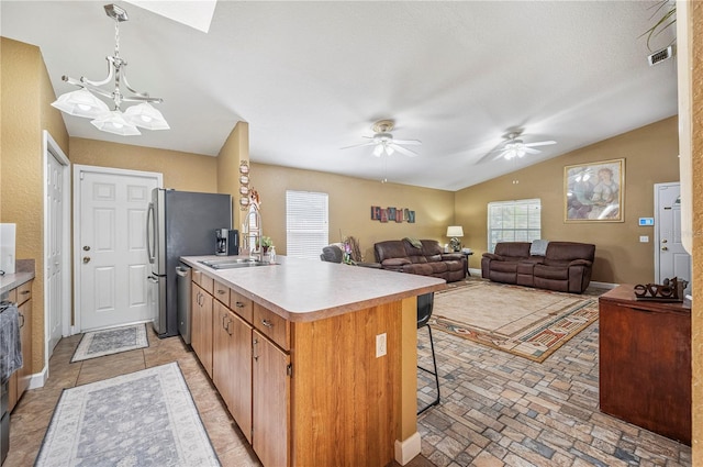 735 Virginia Ave, Auburndale, FL 33823 - kitchen with light countertops, a peninsula, lofted ceiling, a kitchen bar, and a ceiling fan