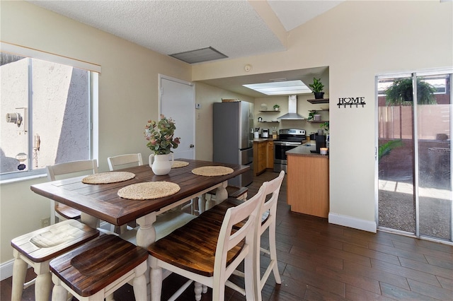 465 Las Cruces, Winter Haven, FL 33884 - dining space with dark wood-style flooring and a textured ceiling