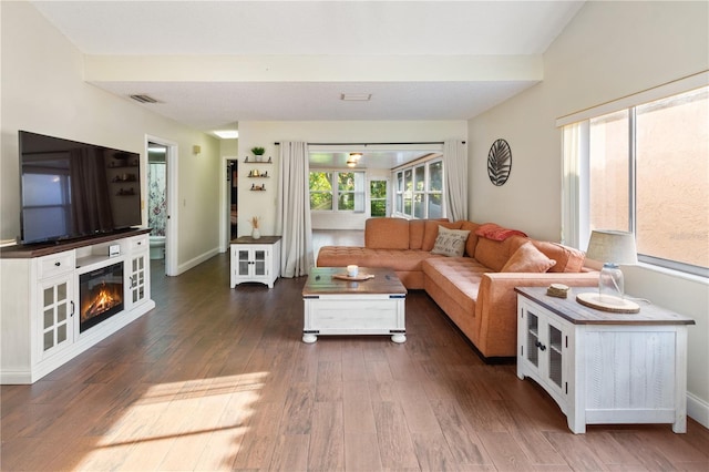 465 Las Cruces, Winter Haven, FL 33884 - living area with wood finished floors and a glass covered fireplace