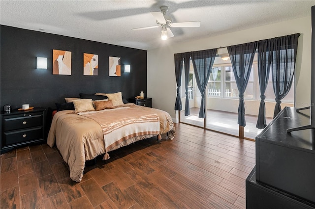 465 Las Cruces, Winter Haven, FL 33884 - bedroom with an accent wall, dark wood finished floors, a textured ceiling, and a ceiling fan