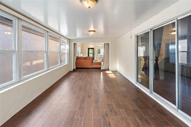 465 Las Cruces, Winter Haven, FL 33884 - unfurnished sunroom featuring wood finished floors