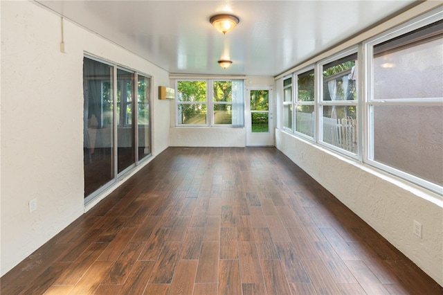 465 Las Cruces, Winter Haven, FL 33884 - unfurnished sunroom with a textured wall and wood finished floors