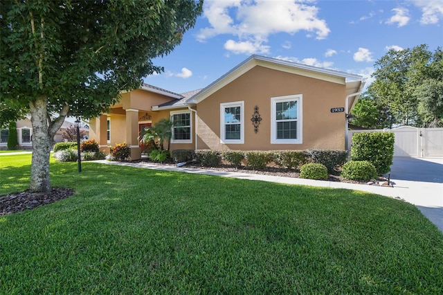 1933 Griffin Trl, Bartow, FL 33830 - view of front of property featuring stucco siding, a gate, and a front yard