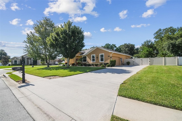 1933 Griffin Trl, Bartow, FL 33830 - single story home featuring a gate, driveway, an attached garage, stucco siding, and a residential view
