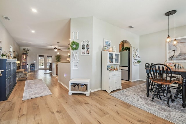 1933 Griffin Trl, Bartow, FL 33830 - dining area featuring a ceiling fan, arched walkways, light wood-style flooring, and recessed lighting