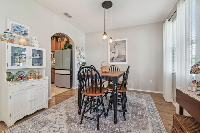 1933 Griffin Trl, Bartow, FL 33830 - dining area with arched walkways and light wood finished floors