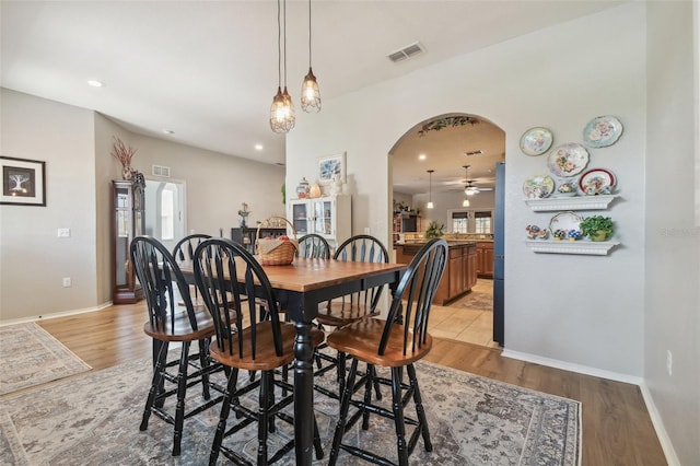 1933 Griffin Trl, Bartow, FL 33830 - dining area with a ceiling fan, arched walkways, light wood-type flooring, plenty of natural light, and recessed lighting