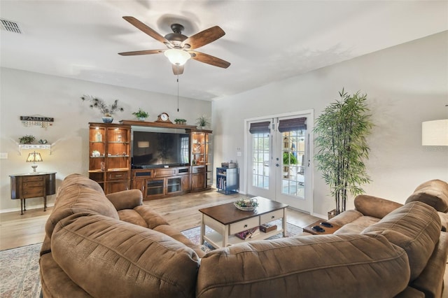 1933 Griffin Trl, Bartow, FL 33830 - living area with french doors, ceiling fan, and light wood-style floors