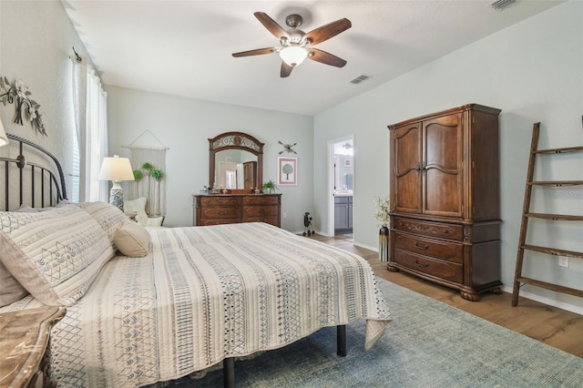 1933 Griffin Trl, Bartow, FL 33830 - bedroom with light wood-style floors, a ceiling fan, and ensuite bathroom
