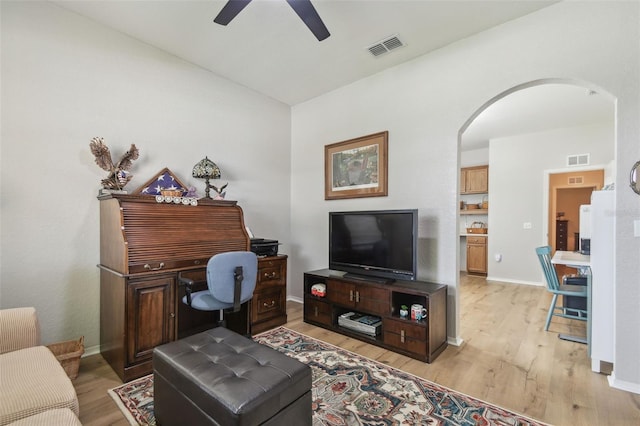 1933 Griffin Trl, Bartow, FL 33830 - living room with light wood-style flooring, ceiling fan, and arched walkways