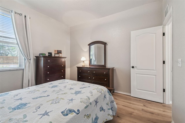 1933 Griffin Trl, Bartow, FL 33830 - bedroom with light wood-type flooring and baseboards