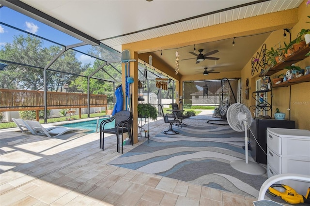 1933 Griffin Trl, Bartow, FL 33830 - fenced backyard with a patio, ceiling fan, an outdoor pool, and a lanai