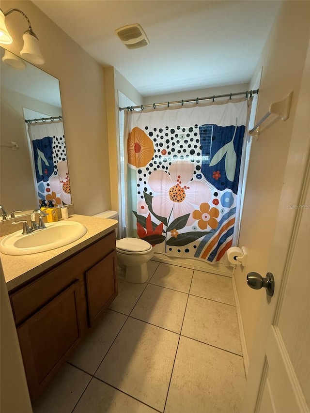 7198 Cedarcrest Blvd, Lakeland, FL 33810 - bathroom featuring vanity, tile patterned floors, and curtained shower